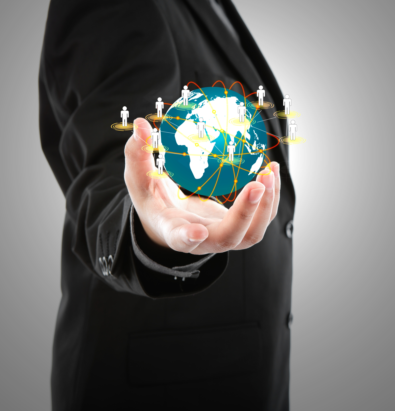 Business man holding the small world in his hands